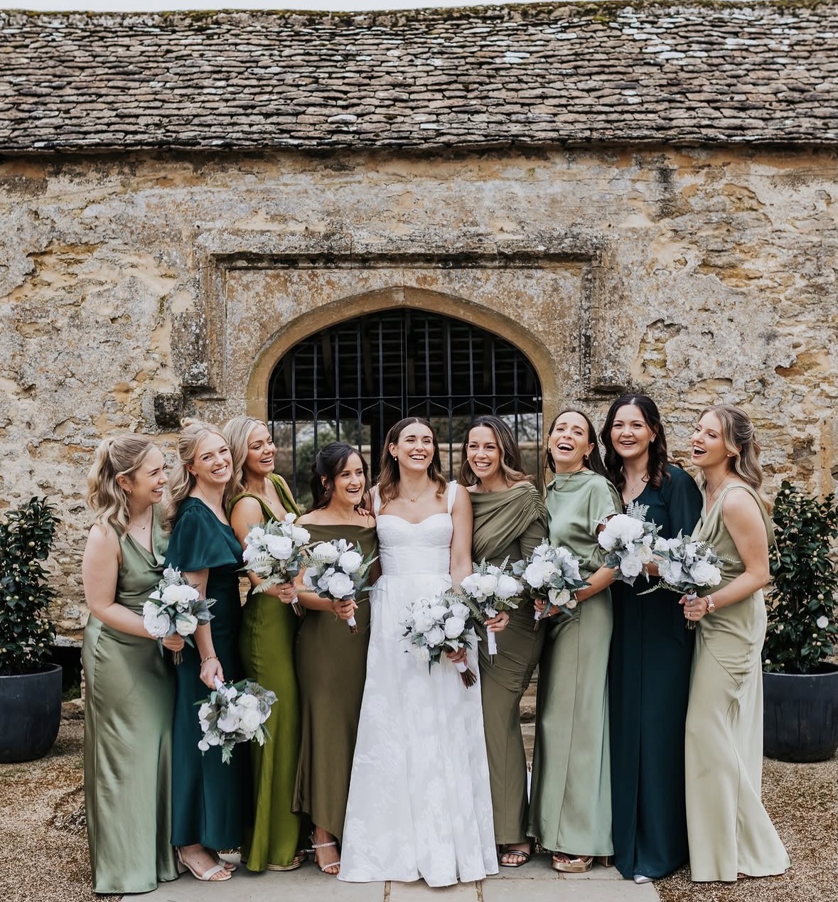 Bridal party carrying realistic faux wedding flowers available to hire